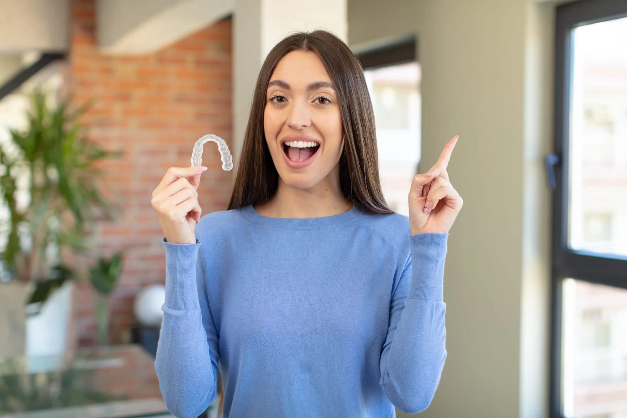 Patient wearing Invisalign clear aligners at Royal Oak Smiles Calgary